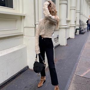 Re/done high rise stove pipe jeans in black.